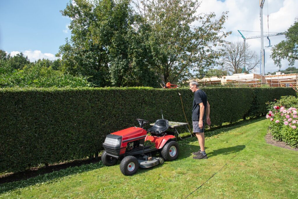 male gardener using a lawn mowing tractor for cutt 2023 03 30 01 17 51 utc 1024x683